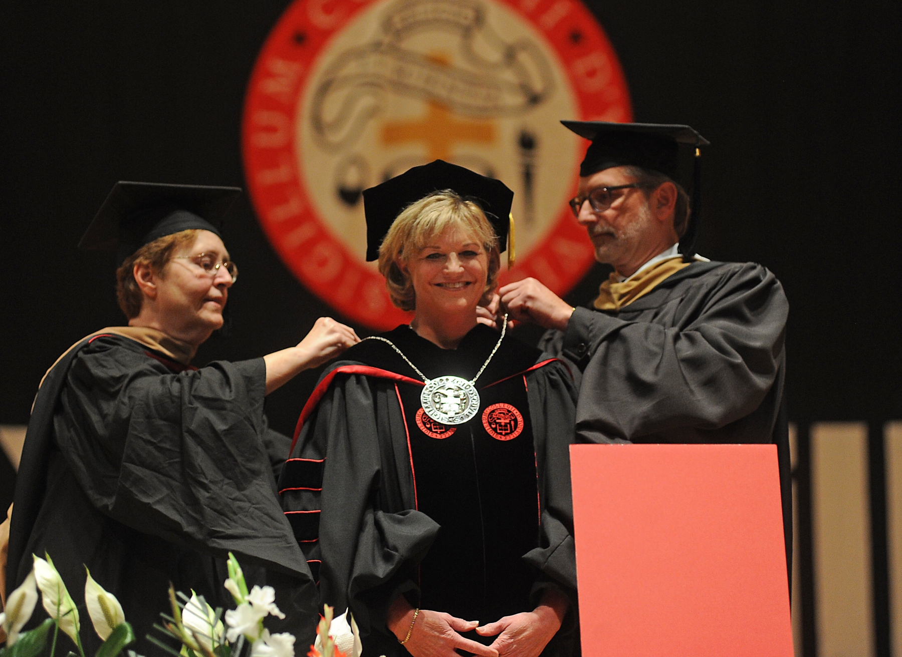 Sister Julia C. Lanigan, president, Grey Nuns of the Sacred Heart, and Charles Urlaub, Chairman, D'Youville College Board of Trustees, place the D'Youville Presidential Medallion on Lorrie A. Clemo, Ph.D. during a ceremony at Kleinhans Music Hall. Clemo is the 15th president of the college.
Dan Cappellazzo/Staff photographer
