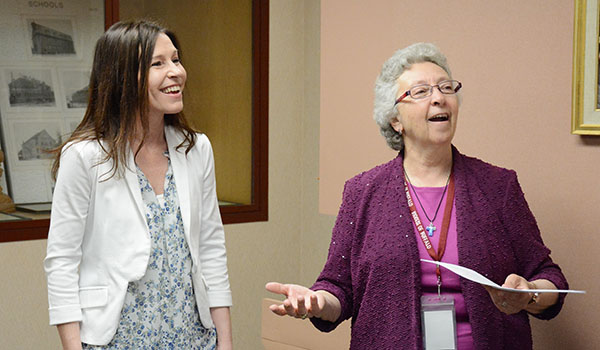 Sister Carol Cimino (right), SSJ, Superintendent of Catholic Schools, receives a $60,000 check from Fidelis Care for a grant called Healthy Minds/Healthy Lives. Representing Fidelis is Jennifer Lyons (left), marketing director. (Patrick McPartland/Managing Editor)