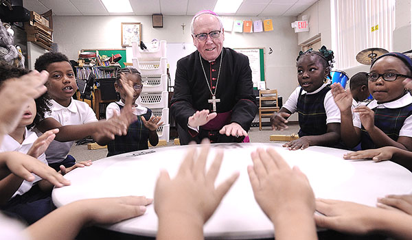 Bishop Richard Malone joins the drum circle in music class on the first day of school with St. Joseph University School students on Main Street, Buffalo.
Dan Cappellazzo/Staff photographer
