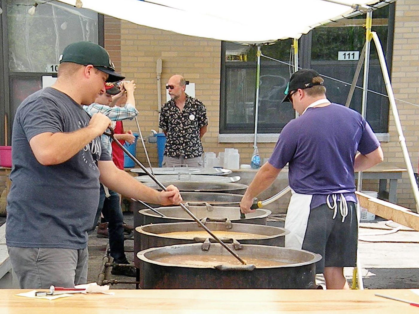 Volunteers stir clam chowder at the Church of the Annunciation picnic. (Courtesy of Church of the Annunciation)