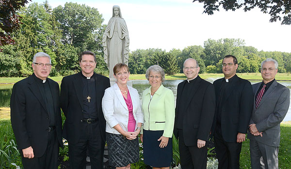Some new faces have joined the faculty and staff at Christ the King Seminary. Now serving at the East Aurora campus are Father Robert Wozniak (left to right), Father John Staak, OMI, Susan Lankes, Eileen Warner, Father F. Patrick Melfi, Father Andrew Lauricella, and Michael Sherry.  Not pictured are Father Michael Monshau and Father John Mack. 
(Patrick McPartland/Staff Photographer)