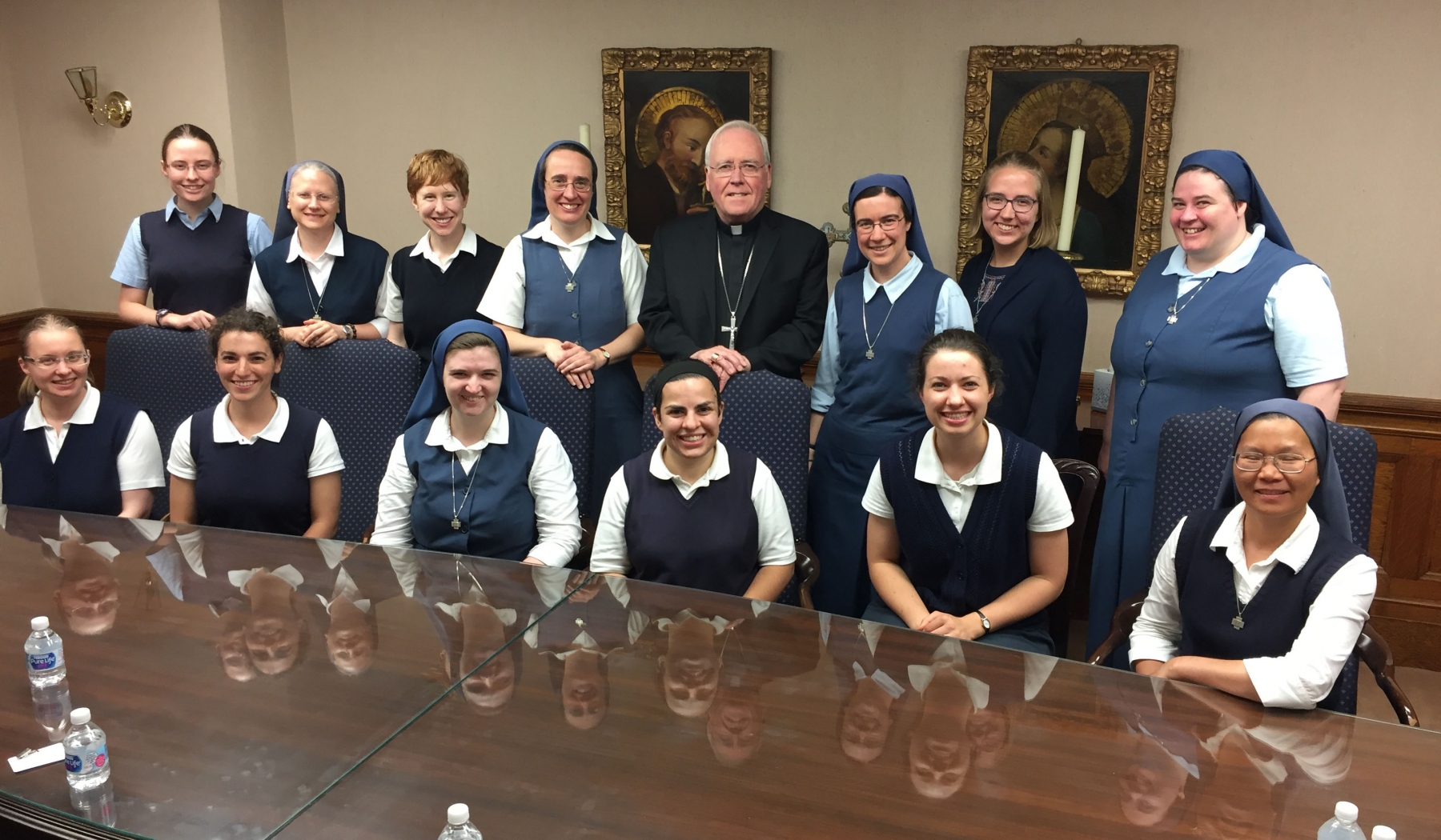 The Daughters of St. Paul meet with Bishop Richard J. Malone as Sister Emily Beata Marsh, FSP (right of Bishop Malone) prepares to make her profession of perpetual vows on June 23.