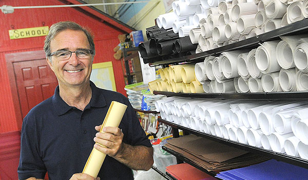 John Mika, director of The Teacher's Desk, stands in front of the `school` inside the building. The organization provides free classroom supplies from their warehouse for teachers in the area. 
(Dan Cappellazzo/Staff Photographer)
