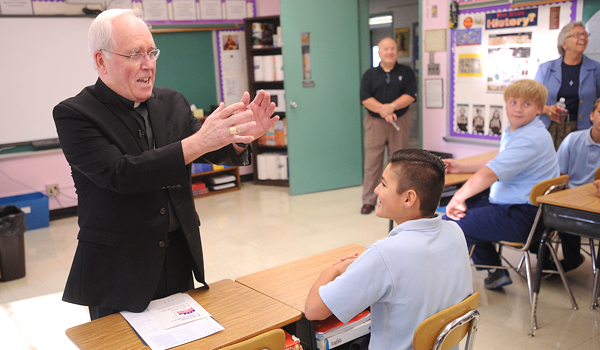 Depew- Bishop Richard Malone speaks to eighth graders at Our Lady of the Blessed Sacrament School on Forming Consciences for Faithful Citizenship. The Bishop also spoke fondly of his days as a teacher in the 70's during his visit to the Depew school's first day of class.
Dan Cappellazzo/Staff Photographer 
