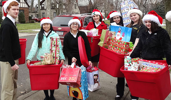 Among members of the Good Samaritan Club at Cardinal O'Hara High School delivering gifts last Christmas are Chris Richards (from left), Megan Barnes, Lizzy DeCarlo, Aly DeMarco, Sheila Wolford, Megan Currie and Ryan O'Neil.