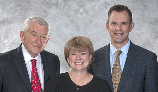 Robert Bennett (from left), Appeal 2018 chairperson, with his children and co-chairs Maurine Bennett Falkowski and Andrew Bennett. (Courtesy of Catholic Charities)