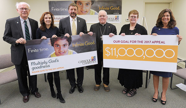 The 2017 Catholic Charities Appeal team gathered for a kickoff announcement Wednesday, Jan. 18, at its headquarters. Parish chairman Rick Cronin (from left), McGuire Group corporate chairperson Jackie Gurney, Catholic Charities CEO Dennis C. Walczyk, Bishop Richard J. Malone, Diocesan Director, Catholic Charities of Buffalo, Sister Mary McCarrick, OSF, and Community Chairperson Kellie Ulrich. This year's goal for the June deadline is $11 Million. (Dan Cappellazzo/Staff Photographer)