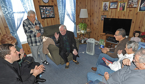 Bishop Richard J. Malone blesses the Rodriguez/Gomez family, of Myrtle Avenue, Buffalo, as he and Father Ryszard Biernat delivered meals to the homebound with Meals on Wheels for Western New York.
Dan Cappellazzo/Staff Photographer


