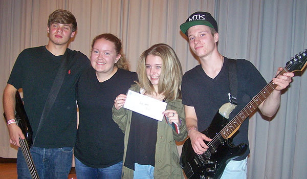 Identical Difference band members Joe D'Ingillo, Skyler Bogdan,Taylor Bogdan and Dominic Imperi show off their winning gift certificate to Guitar Center. The band won the ninth annual Mountstock battle of the bands at Mount St. Mary Academy in Kenmore on Oct. 1. (Patrick J. Buechi/Staff)