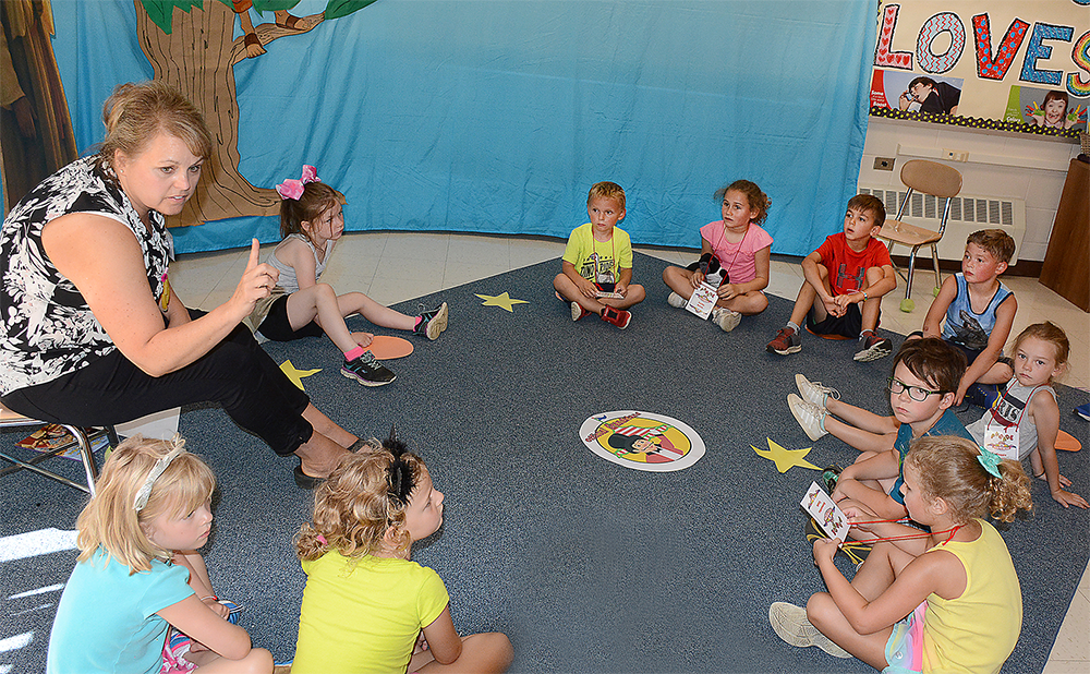 (Dan Cappellazzo/Staff Photographer)
St. Bernadette Church Summer Bible Camp Bible study teacher Paula Mruk teaches kindergarden age  students about the joys of the Bible. A circus theme in the gym, and many programs including, music, crafts, games and Bible study are all part of the annual camp which is so popular alumni return each year to help with the younger children.