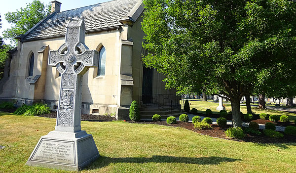 Outside of Mount Olivet's Ascension Chapel and Columbarium, a Celtic cross can be found signifying the burial place of Bishop William Turner. (Connor Keenan)