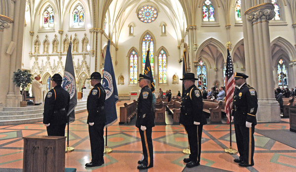 Local members of law enforcement, fire and emergency medical services make up the honor guard Saturday afternoon at St. Joseph Cathedral during the Blue mass honoring men and women in uniform. (Dan Cappellazzo/Staff Photographer)