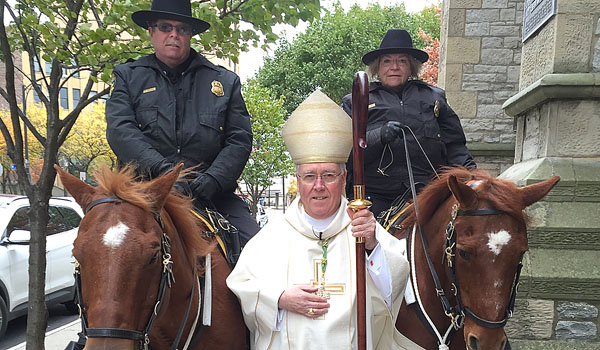Bishop Richard J. Malone takes a moment with some mounted police before the Blue Mass at St. Joseph Cathedral
(Courtesy of Marie O'Connor)