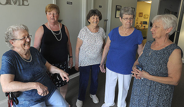 Five sisters that live in the Brothers of Mercy Senior Apartments Gay Truesdale, (from left), Eloise Folan, Loretta Weldgen, Sharon Covert and Evelyn Mason share a laugh after lunch. (Dan Cappellazzo/Staff Photographer)