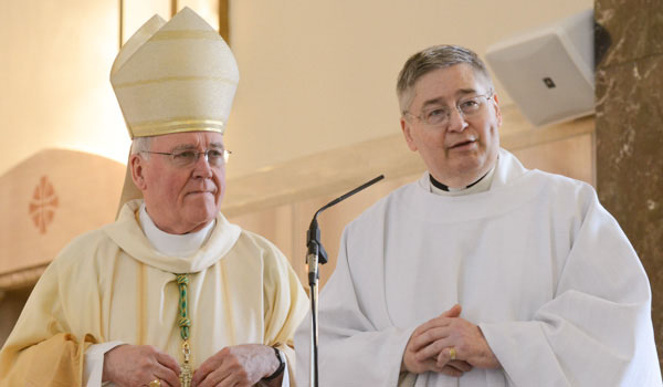 Bishop Richard J. Malone installs Father Michael Burzynski as administrator of St. John Kanty Parish. (Patrick McPartland/Managing Editor)
