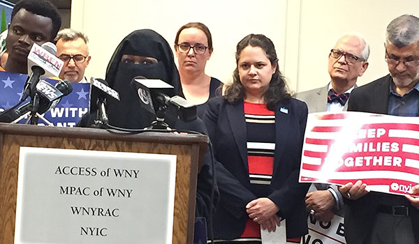 Kawiye Jumale, chief program officer for People United for sustainable housing, speaks at a press conference regarding the Supreme Court ruling in favor of a travel ban for Muslim countries. Catholic Charities and other local refugee organizations held the June 28 press conference at Catholic Charities headquarters in Buffalo. (Patrick J. Buechi/Staff)