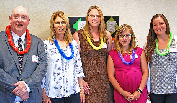 Dan Greene, district director for Catholic Charities' services in Genesee, Wyoming and Orleans counties and the Tri-County staff: Carol Norton (left to right), senior secretary; Heather Bell, social worker; Samantha Elliott, social worker, and Jami Wood, social worker. (Courtesy of Catholic Charities)