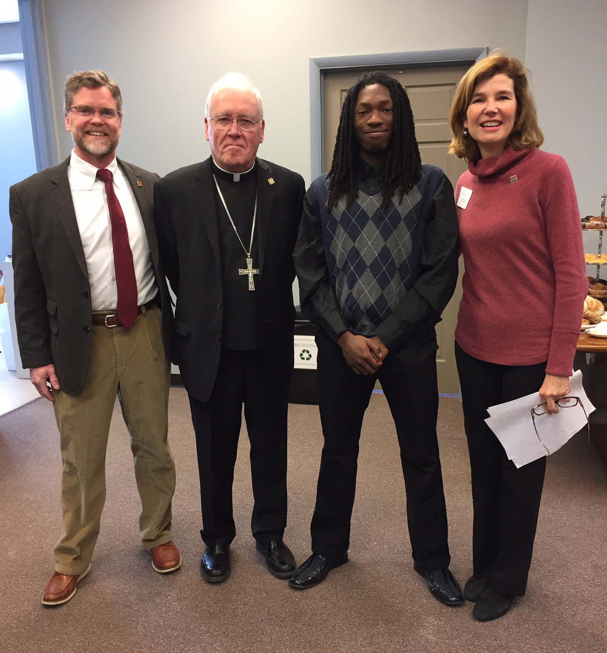 Bishop Malone with Jamie Bin-huguley who spoke at the workshop; along with Catholic Charities Appeal General Chairs John & Ruthanne Daly. 