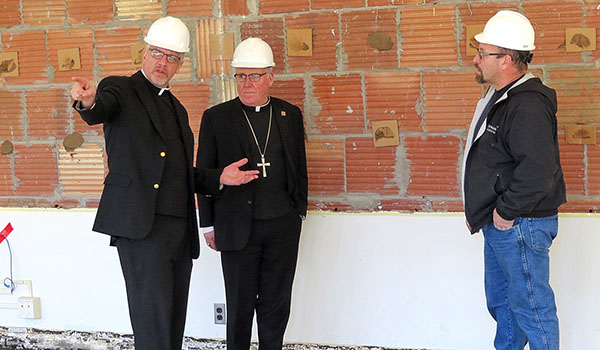 Bishop Richard J. Malone (center) surveys the construction underway at Christ the King Seminary with Father Joseph Gatto (left), president-rector, and Michael Moltrup, faculties. (Courtesy of Christ the King Seminary)