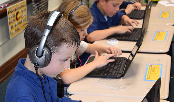 Teacher Abby Budzinski-Lake's second-grade class benefits from a social studies lesson on a Chromebook. (Courtesy of St. Mary Swormville)