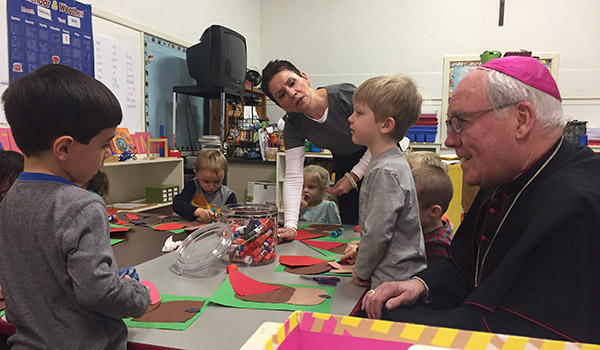 Bishop Richard J. Malone visits the Montessori PreK room at the St. Aloysius Regional Catholic School. (Mark Ciemcioch/Online Content Coordinator)