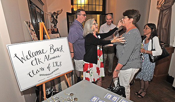 Former students of the Christ the King Class of 1968 gather before Mass to celebrate their 50th reunion in July. (Dan Cappellazzo/Staff Photographer)