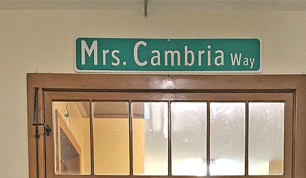 The Elaine Cambria memorial signpost at St. John the Baptist School in Kenmore is dedicated to Cambria, who spent most of her 37-year career teaching kindergarten at the school. 