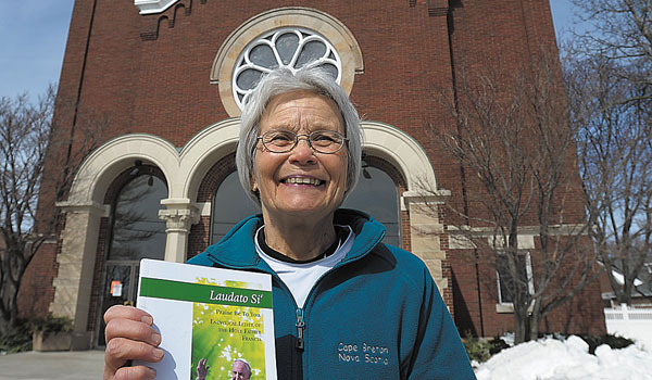 Sandra Kucharski stands in front of SS. Peter & Paul Church in Hamburg. She is involved with the nature trails near the church and the parish's Care for Creation project. (Dan Cappellazzo/Staff Photographer)