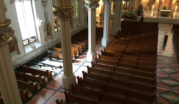 Several damaged pews were removed following a fire at St. Joseph Cathedral in Buffalo Friday morning. (Photo by George Richert)