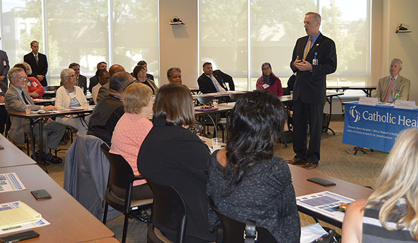 Mark Sullivan, President & CEO of  Catholic Health, congratulates recipients of the health system's 2018 Community Benefits Grants. (Courtesy of Catholic Health)