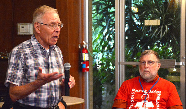 Lutheran pastor Rev. Daniel Hoffman listens as Father Peter Drilling speaks during a gather in the dining hall at Christ the King Seminary for a discussion about the 500th Commemoration of the Reformation and the ongoing Lutheran-Roman Catholic cooperative efforts. (Dan Cappellazzo/Staff Photographer)