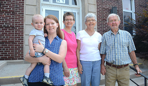Katie Bishop (from left), holding her son Matthew, Donna Allan, Kathleen and Donald Herberger span three generations of graduates from St. Mary School in Swormville. Young Matthew will be the fifth generation to attend the school.