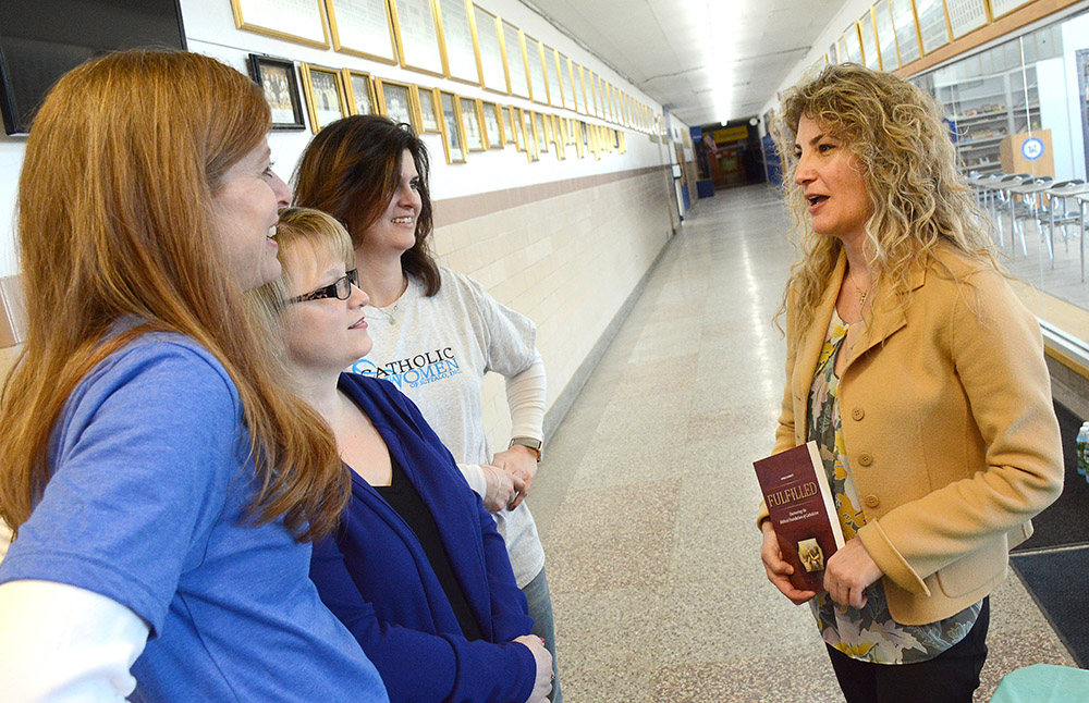 The fourth Annual Catholic Women's Conference, `Nourished by Christ,` Keynote speaker Sonja Corbitt speaks conference organizers Amy Blair, Our Lady of Pompeii, Valerie Zafuto, St. John de LaSalle, and Annie Esposito, St. Vincent DePaul at St. Mary's High School in Lancaster. Corbitt, who is from Nashville, is a Bible Study Evangelista and creator of the `Love the Word Bible study method and Mary Journal. She has written three liturgical books, her latest entitled `Fulfilled.
Dan Cappellazzo/Staff photographer