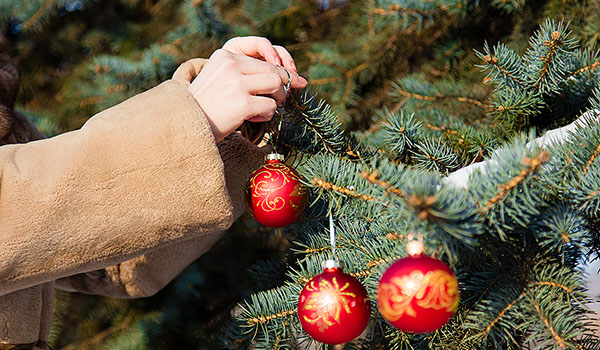 Decorating the tree can be an act of togetherness when among family and friends.