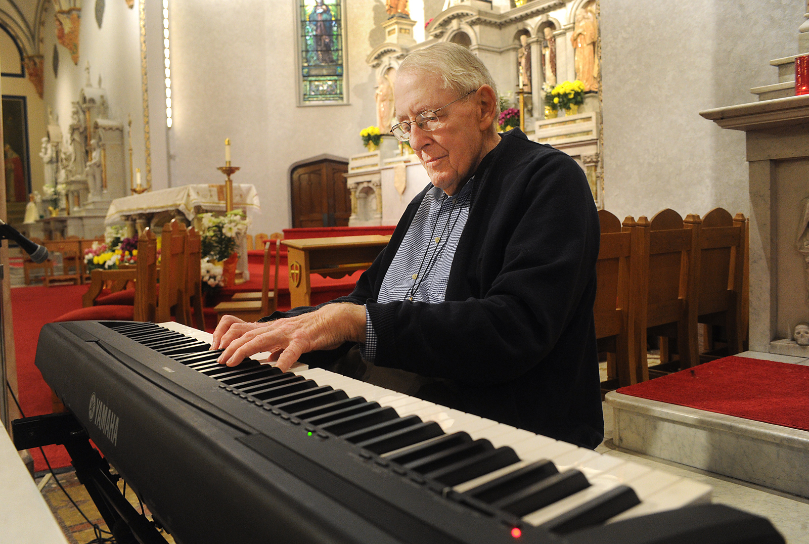 Bob Chambers, long time organist for Holy Angels Parish will be honored on May 13. He is 85, been playing for the church since 1947. He is an honorary Franciscan and Oblate, so he has habits and crosses. 
(Dan Cappellazzo/Staff photographer)