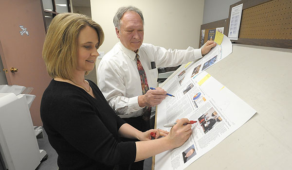 Managing Editor Rick Franusiak goes over proofs with Graphic Designer Carolyn Luick. (Patrick McPartland/Staff Photographer)