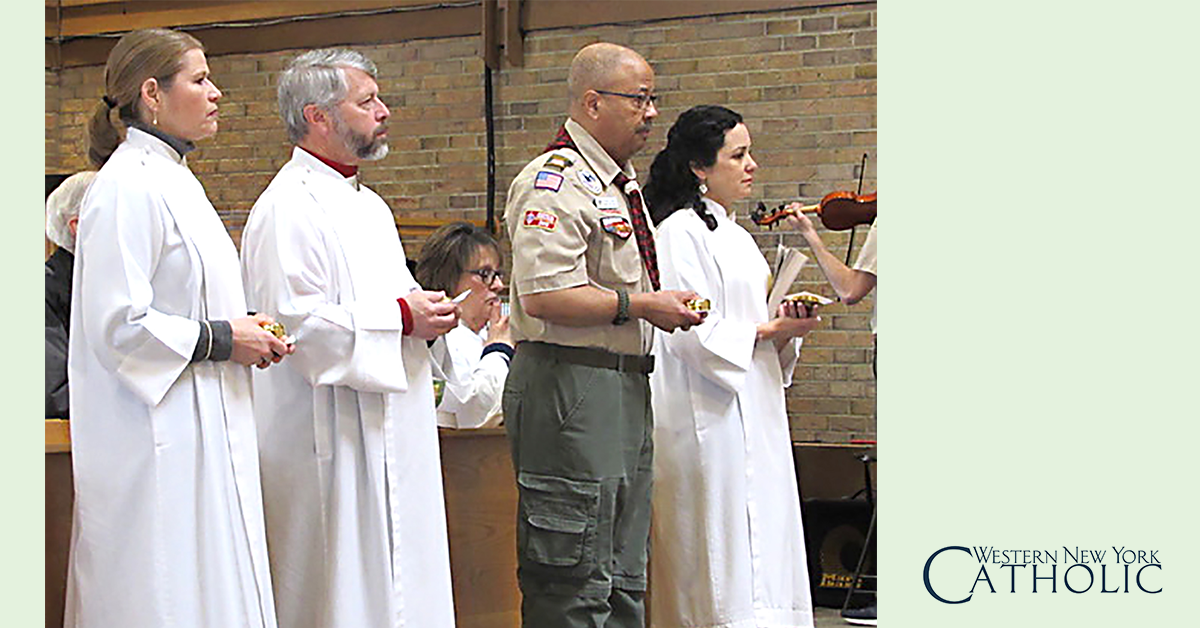 Eucharistic Ministers - Linda Wach, Don Wach, Felton Davis and Tracy Cromwell, Eucharistic Ministers at St. Bernadette's in Orchard Park, hold their pyx with the Eucharistic during at the Mass. Eucharistic Ministers bring prayers and Communion to the sick, home bound and nursing home residents. (Photo by Donna Mitchell WNYC Intern)