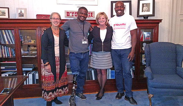 Dr. Sarah P. Pictor (from left), clinical associate professor of D'Youville College's Physical Therapy Department; Wilfrid Macena, a prosthetic technician from Haiti; D'Youville College President Dr. Lorrie Clemo; and Cedieu Fortilus, a rehabilitation tech from Haiti. (Courtesy of D'Youville College)