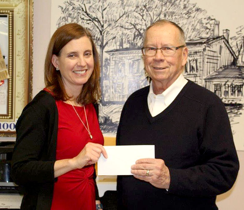 DeSales Principal, Karen Rahill accepts a $200,000 check from Foundation President, Dan Judge.  (Courtesy of DeSales School)