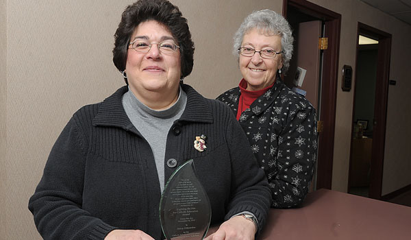 Nancy DiBerardino (left) has been awarded the Lighting the Fire For Education Award from the Catholic School Administration Association of New York State. Superintendent of Catholic Schools, Sister Carol Cimino, SSJ, stands by DiBerardino's side. (Patrick McPartland/Staff Photographer)