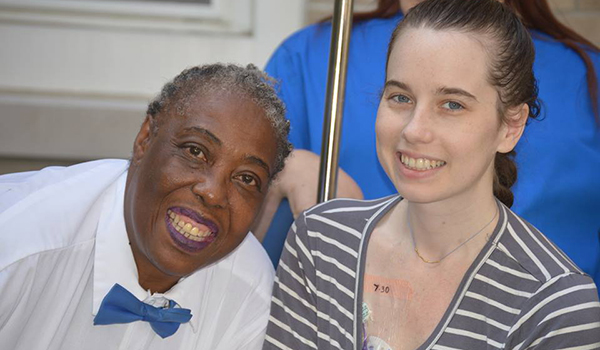 Gloria Peay (left) has helped brighten the day of Diana Donnarumma during her hospital stay. (Courtesy of Kenmore Mercy Hospital)