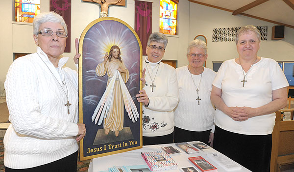 Charlene McGraw (left to right), Angie Bator, Joann Wander and Maria Maraschiello are planning the Divine Mercy Sunday at St. Pius the X Parish. (Patrick McPartland/Staff Photographer)