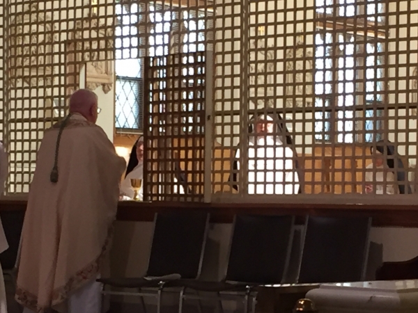 Bishop Edward Grosz offers Holy Communion to Dominican Sisters at Monastery of Our Lady of the Rosary