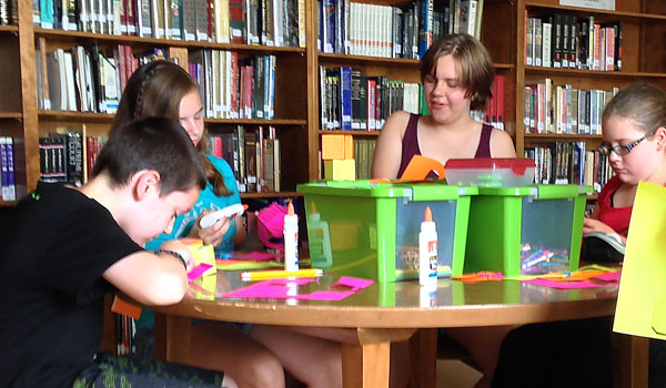 Cardinal O'Hara High School welcomed fifth- through eighth-graders to a creative writing camp taught by COHS English teacher Patrick Goatseay in the school's library. (Kimberlee Sabshin/Staff)