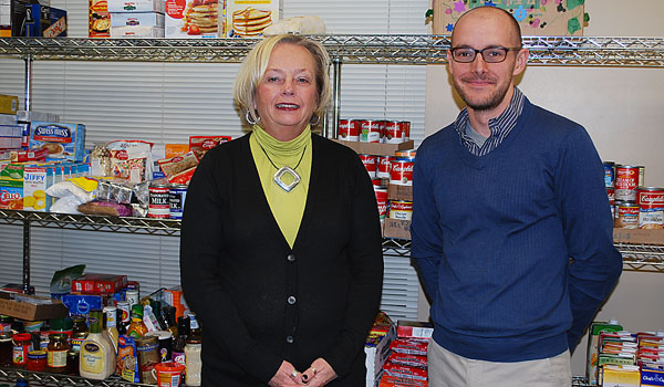 Eileen Nowak and Assistant Rabi Adam Scheldt of Temple Beth Zion stand in the new food pantry, which will service Getzville and Williamsville residents. (Courtesy of Catholic Charities)