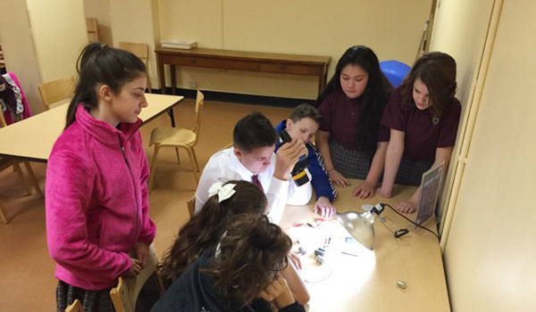 Students (standing, from left) Alexa Battaglia, Naomi Stanley, Lauren Wegman, (seated, from left) Kaila Panaro, Gianna Padula, David Kassem and Patrick Maiarana take part in an energy project.