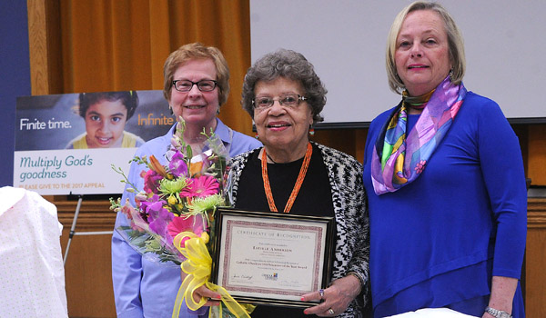 Catholic Charities USA Volunteer of the Year with Ladies of Charity Estelle Anderson (center) holds her award with Kathy Sierack, president of Ladies of Charity (left), and Director of Parish Outreach and Advocacy Eileen Nowak at the Catholic Charities Lackawanna Food Pantry & Outreach. (Dan Cappellazzo/Staff Photographer)