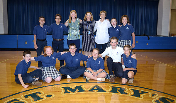 Bishop Richard J. Malone greets students at the diocesan convocation and professional development day for all of the diocesan school staff at Cardinal O'Hara High School. Joining the bishop are Matthew, Mary Claire and Meghan Carver, Catherine, Bridget and Anna Gracon, and Mary Grace Wood.