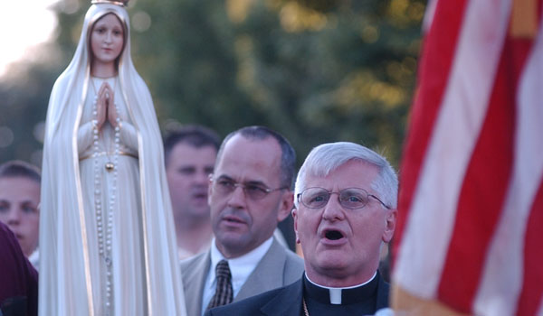 Bishop Edward M. Grosz proceeds with the Fatima statue. (WNYC File Photo)