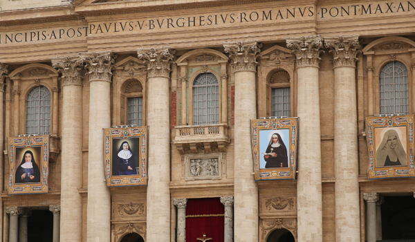 Tapestries in St. Peter's Square show four saints canonized May 17: Marie Alphonsine Danil Ghattas, Jeanne Emilie de Villeneuve, Maria Cristina Brando, and Mariam Baouardy. (Daniel Ibanez / CNA)